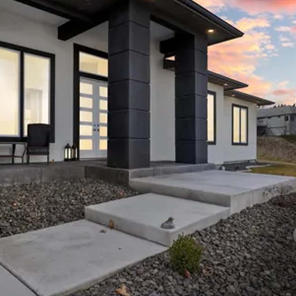 Sophisticated modern entrance at Cherry Creek Adult Family Home in Kennewick, featuring a flat-roof architectural design, accessible concrete steps, and a glass-paneled entry for premier 24-hour residential care. Sophisticated modern entrance at Cherry Creek Adult Family Home in Kennewick, featuring a flat-roof architectural design, accessible concrete steps, and a glass-paneled entry for premier 24-hour residential care.