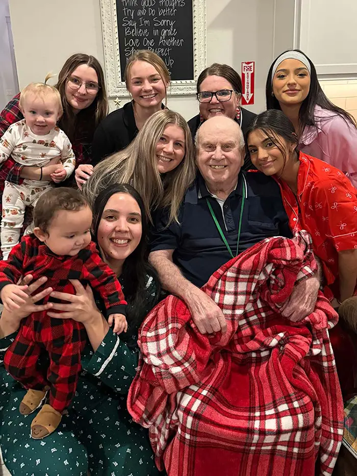 Joyful family visit at Cherry Creek AFH in Kennewick, highlighting our welcoming 24-hour care.