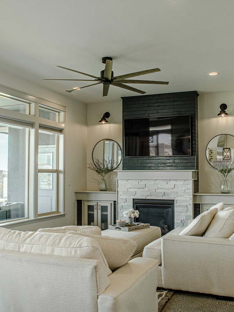 Modern, cozy living room with a fireplace at Cherry Creek at Sunrise Ridge in Kennewick.