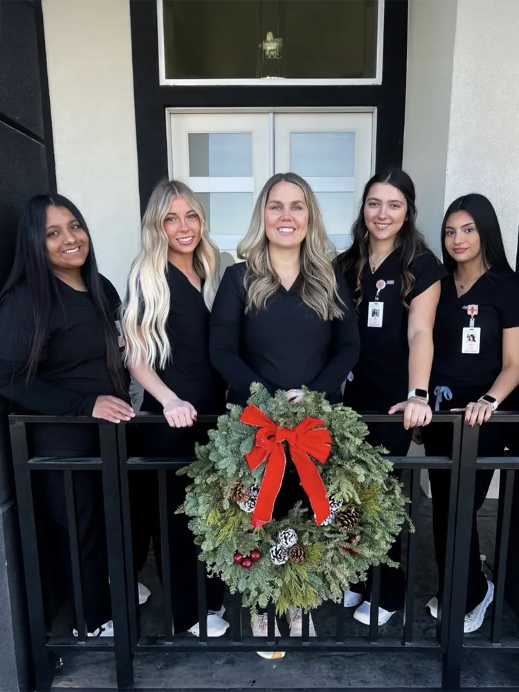 Friendly staff celebrating holidays with residents at Cherry Creek AFH in Kennewick, WA.